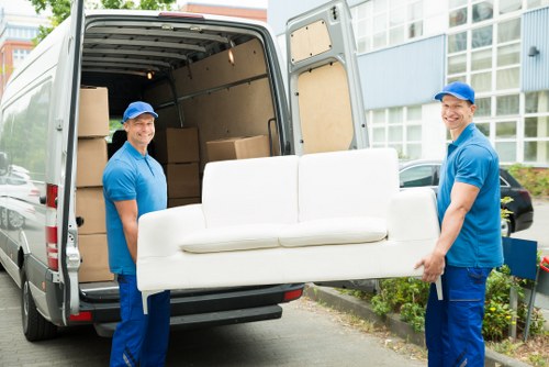 Man and van moving a sofa in Notting Hill street