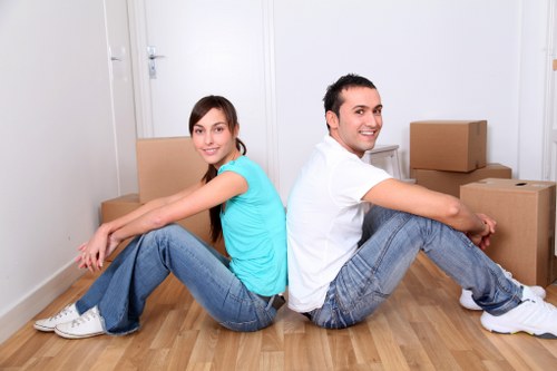 Packed office boxes and furniture ready for relocation in West London