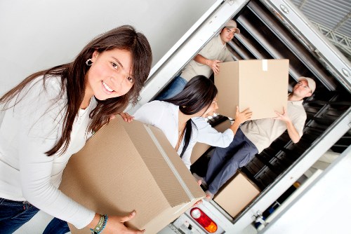 Professional removals team loading items for a domestic or commercial move